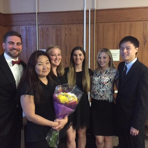 Touro professor June Kume (holding flowers) and her team of DPT students that studied the effect of music on running performance.