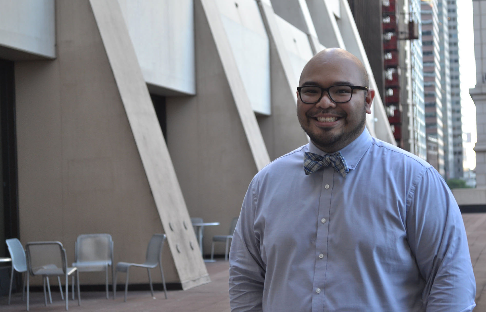 Lyndon Llanes standing in front of building