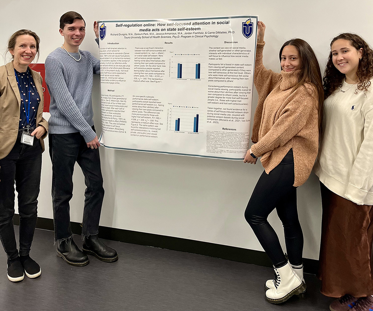 four presenters in front of poster for self-regulation presentation