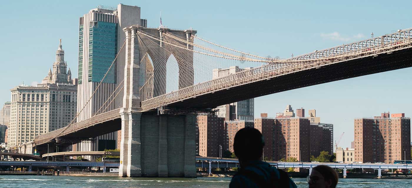 people walking near the brooklyn bridge