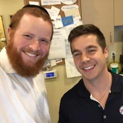 DPT student Avi Friedman spent six weeks studying with the team physical therapist of the Philadelphia 76ers Justin Jiunta (right).
