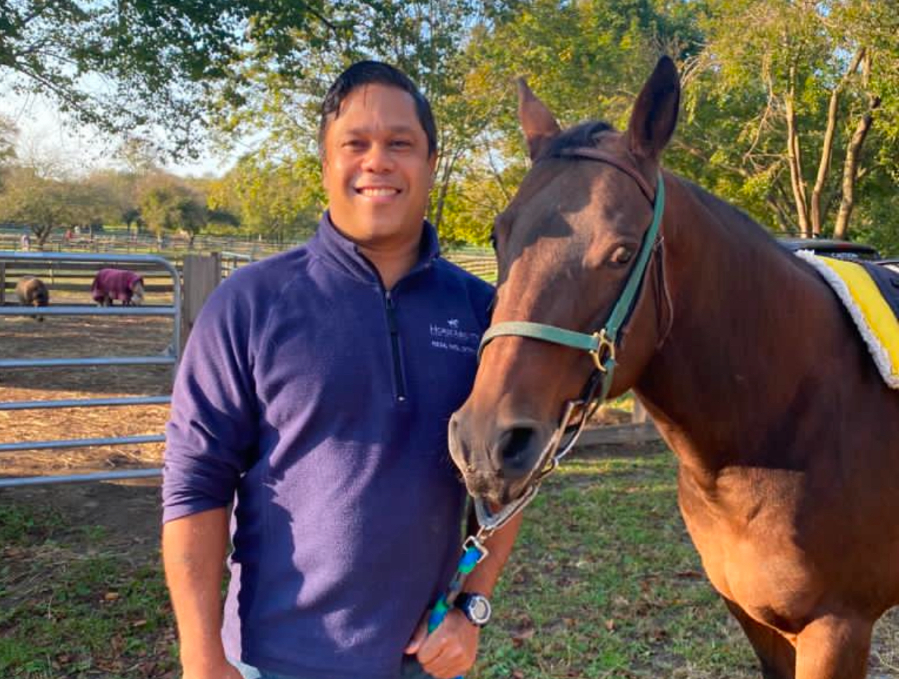 Dr. Rem Narain and a horse.