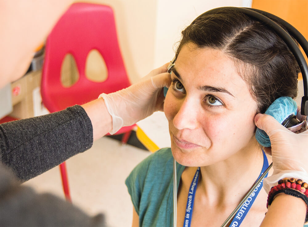 Students practice using sound monitoring equipment in the new speech and hearing center at Touro School of Health Sciences.