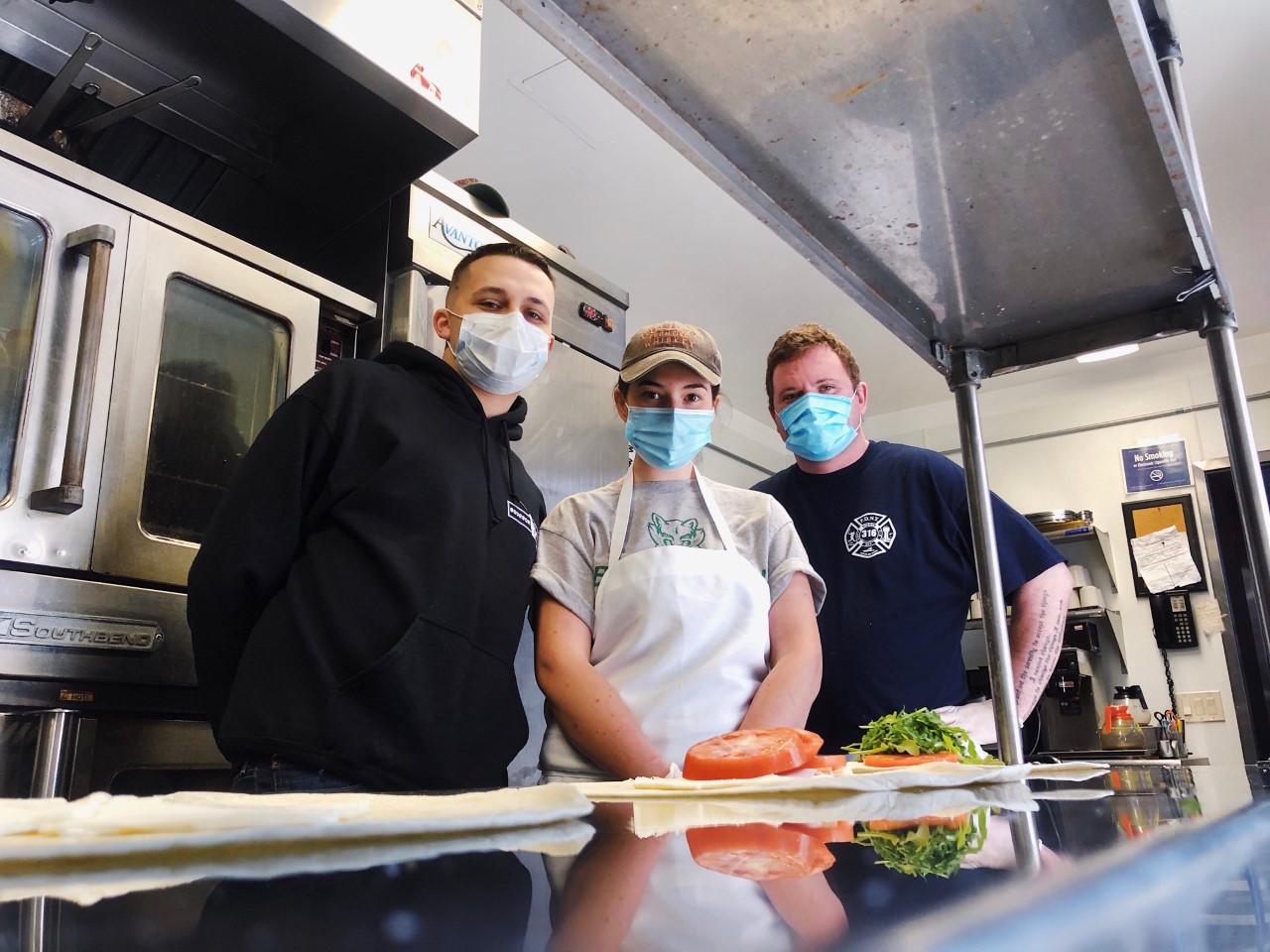 Physician Assistant (PA) student, Mark Boccia, is pictured on the left while assembling the food to be delivered to healthcare workers assisting COVID-19 patients.