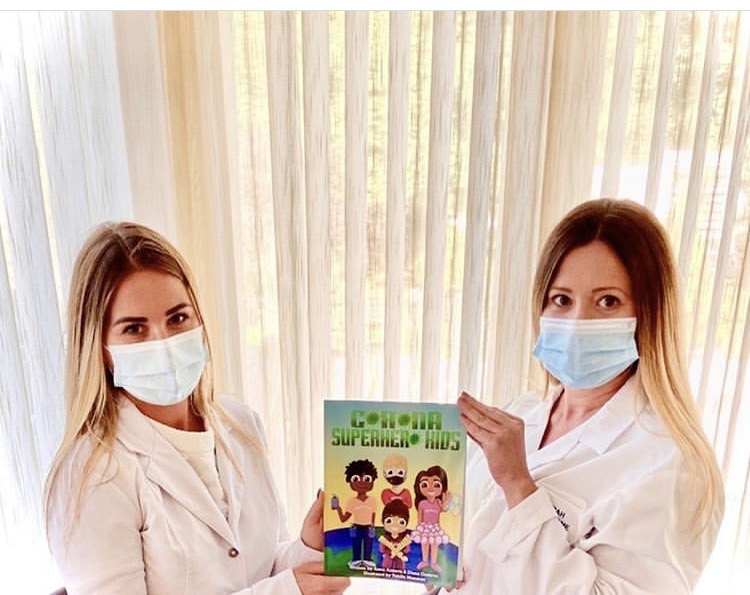 Occupational therapists and Touro School of Health Sciences alums Diana Gosteva and Anna Astrova pose with their new book.