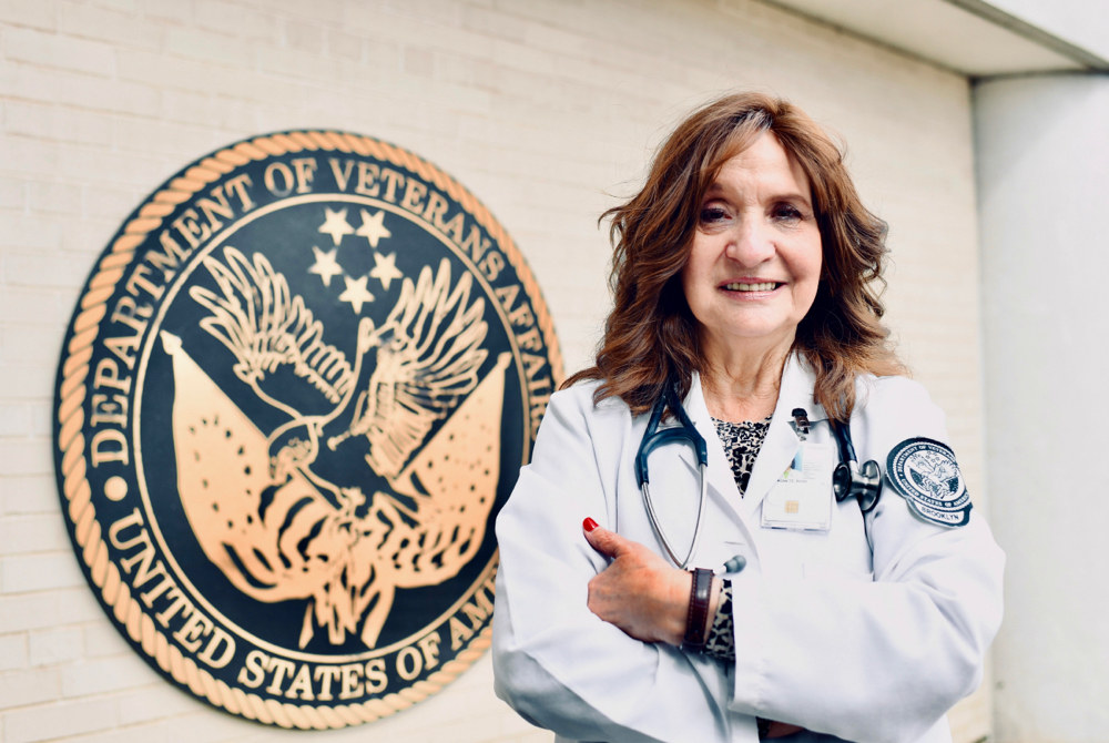 Rose Lefkowitz standing in front of department of veterans affairs sign